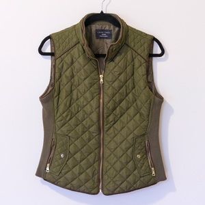 Green vest with gold hardware